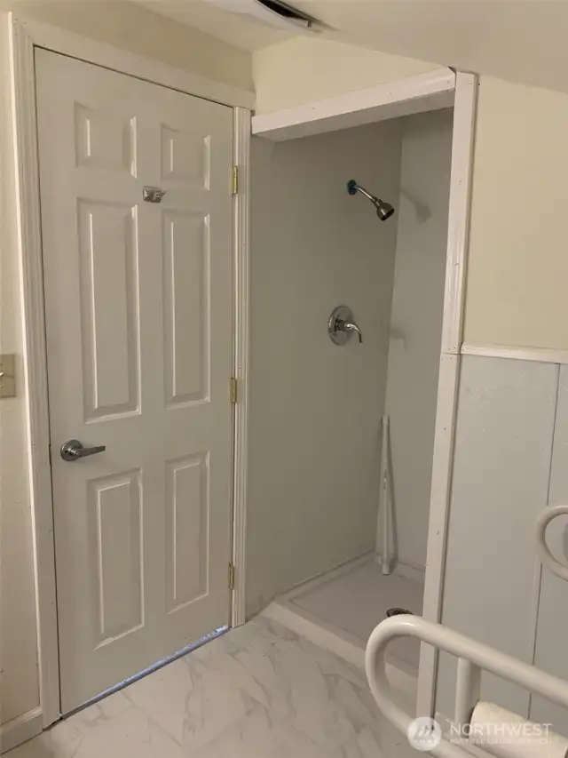 View of the shower in the third bathroom.