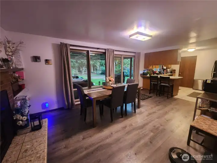 Dining room with ample windows and gas fireplace