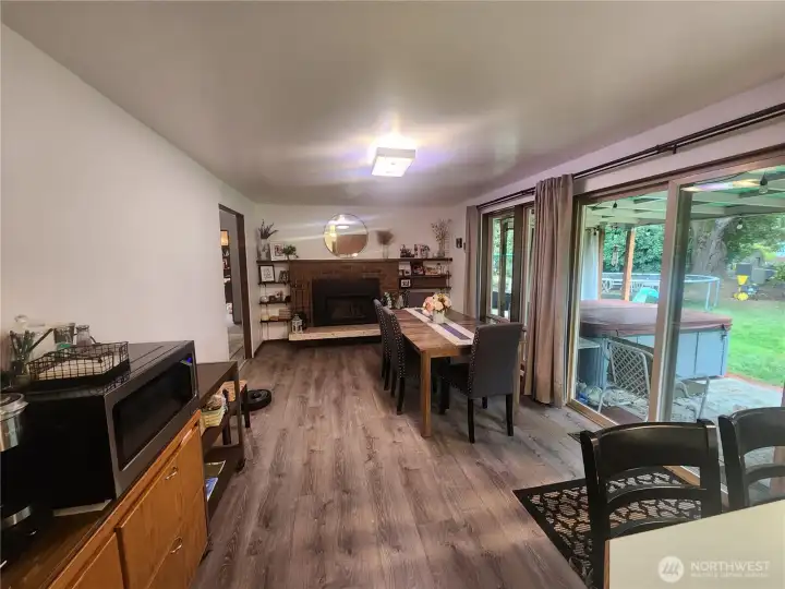 Dining room with ample windows and gas fireplace