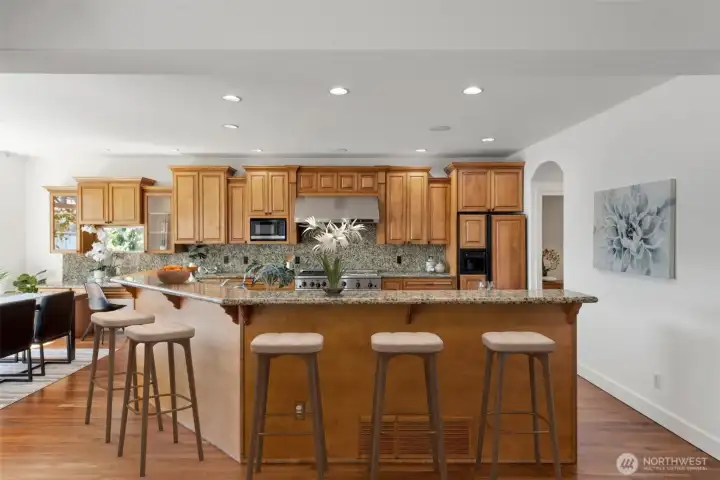 This timeless gourmet kitchen boasts solid wood cabinets and gorgeous granite countertops.