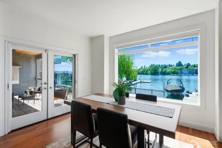 Casual dining area with French doors leading to the covered deck.