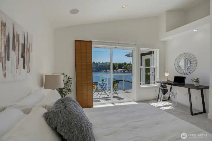 One of four bedrooms. This bedroom has a sliding glass door leading the upper deck.