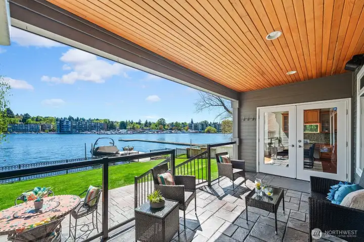 Impressive covered deck above the large patio and lawn, perfect for entertaining.