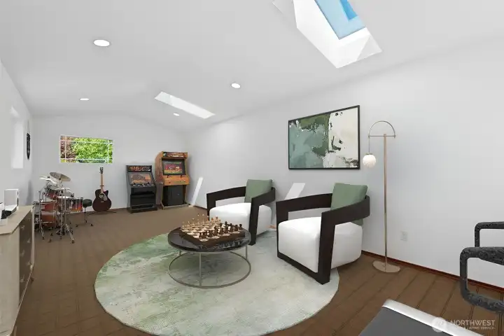 Spacious Studio above the garage. Perfect to use as a music room, media room, gym, office or creative space! This photo is virtually staged.
