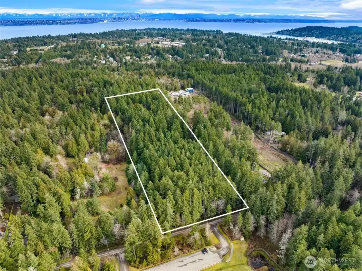 You can see Seattle in the distance. Just a 35 minute ferry ride to downtown Seattle via the Bainbridge Ferry. Have a peaceful quality of life in an island setting with an international world class city nearby. Divide into 4 parcels or keep it as one for a quality estate.
