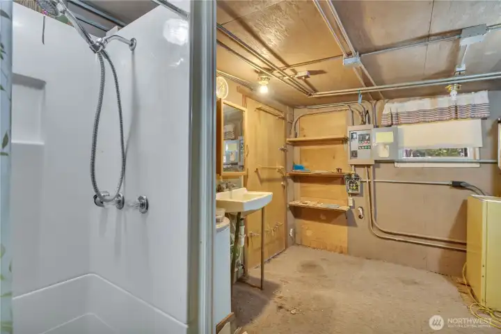 Main floor shower, sink and laundry area