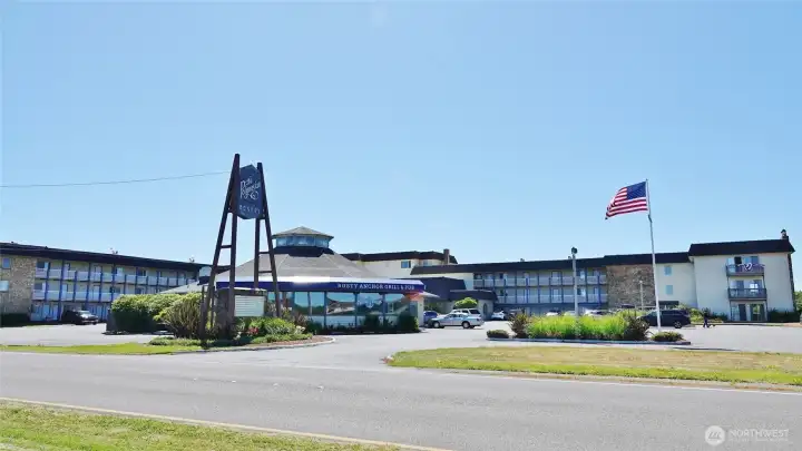 Front view of the Polynesian Hotel Condo building w/ The Rusty Anchor Restaurant.