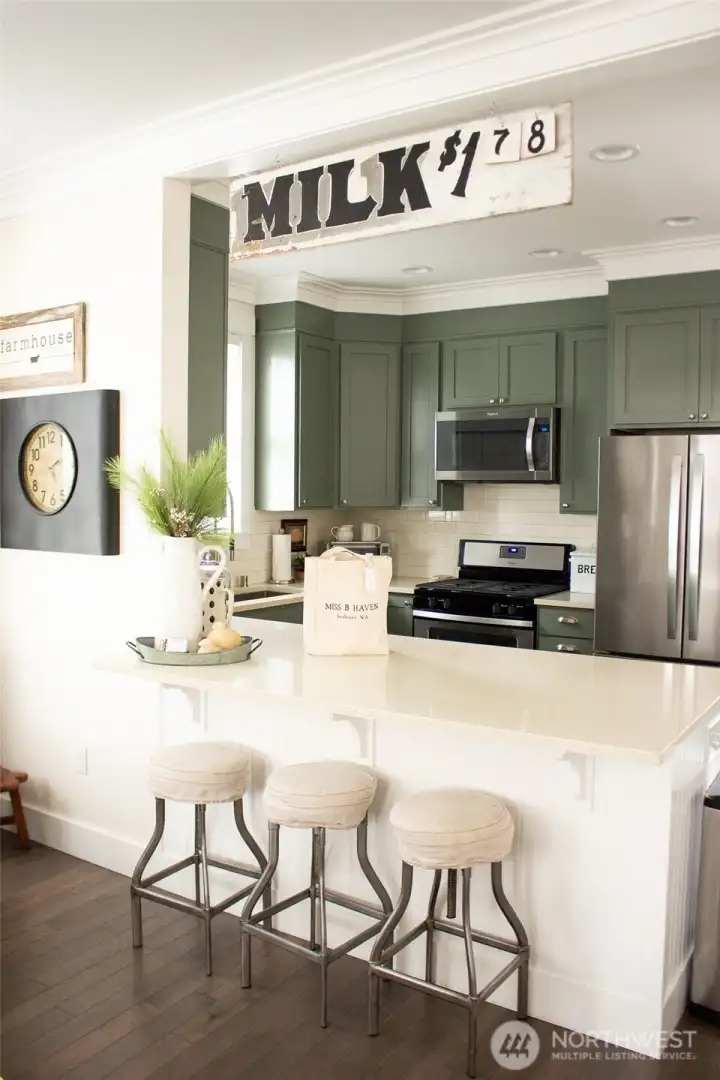 Off the living space is the kitchen with a large counter to enjoy your morning coffee.