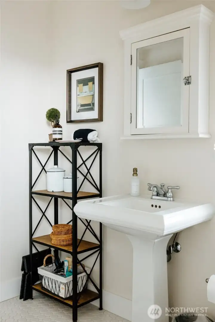 and it shares this large bathroom with the third upstairs bedroom with two twin beds.