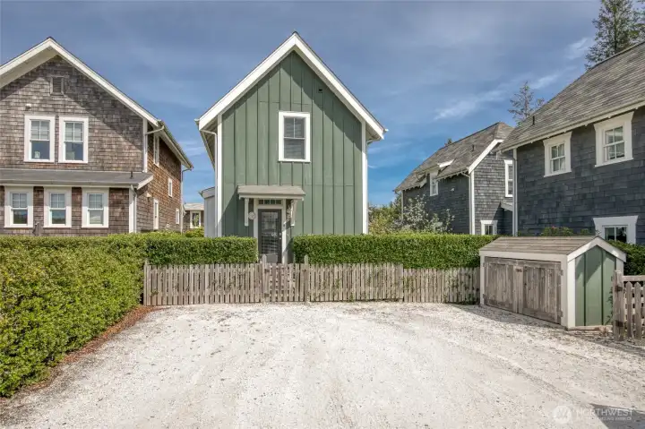 The back alley (Blueberry Lane) is quiet and has space for two large cars. It includes a storage shed.