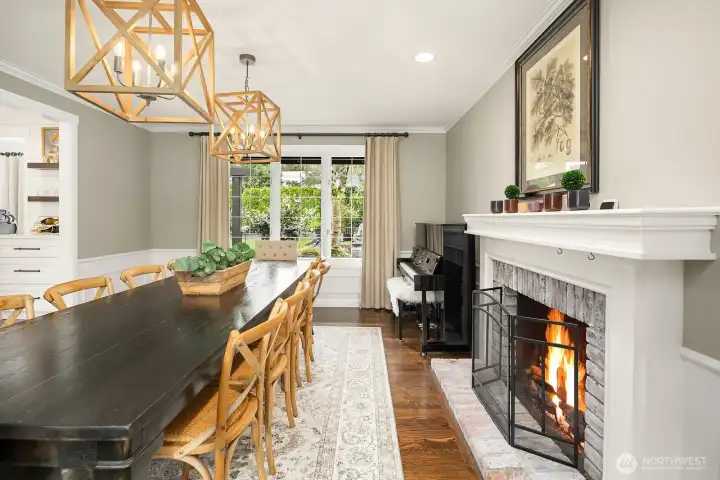 This angle beautifully captures the flow between the formal dining room and the living area, with the stunning new fireplace insert serving as an elegant anchor point between the two spaces.