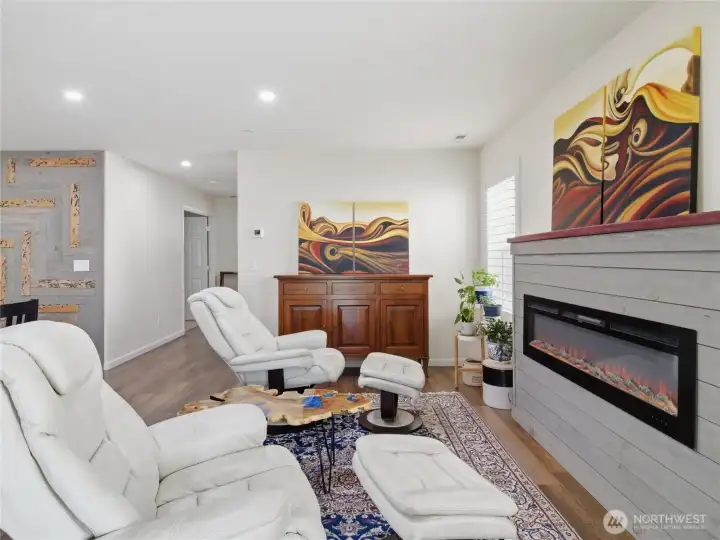 Bright natural light and a cozy fireplace bring warmth and natural light into the main living area while maintaining an open, connected feel. Bright natural light and a cozy fireplace bring warmth and natural light into the main living area while maintaining an open, connected feel.