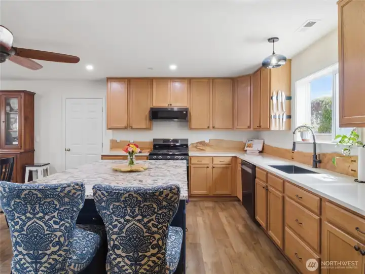 The oversized island provides additional seating, prep space, and a natural gathering spot at the center of the kitchen. The oversized island provides additional seating, prep space, and a natural gathering spot at the center of the kitchen.
