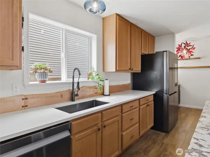 With expansive counter space, ample storage, and an open layout, this kitchen is designed to comfortably handle both busy mornings and larger gatherings. With expansive counter space, ample storage, and an open layout, this kitchen is designed to comfortably handle both busy mornings and larger gatherings.
