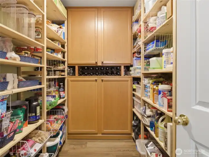 A spacious walk-in pantry offers exceptional storage and organization space rarely found in homes this size and price point. A spacious walk-in pantry offers exceptional storage and organization space rarely found in homes this size and price point.