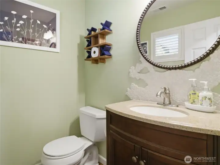 The updated powder room adds character and functionality with tasteful finishes and convenient main-floor access. The updated powder room adds character and functionality with tasteful finishes and convenient main-floor access.