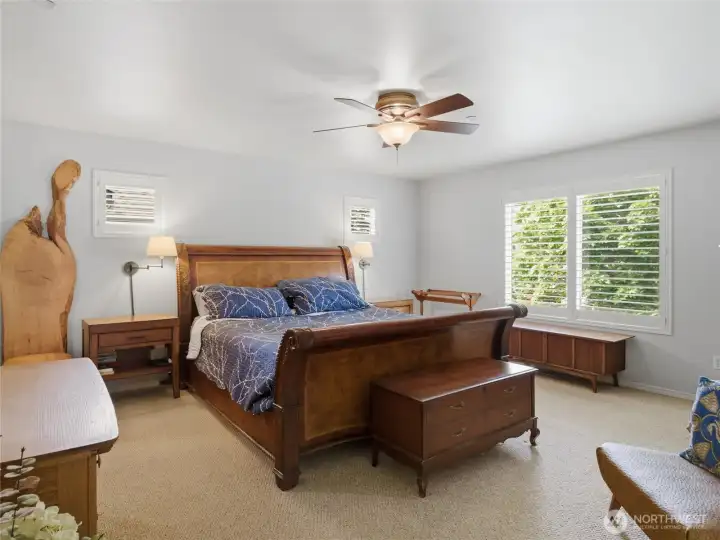 The spacious primary suite offers a comfortable retreat with large windows, natural light, and room for oversized furniture. The spacious primary suite offers a comfortable retreat with large windows, natural light, and room for oversized furniture.