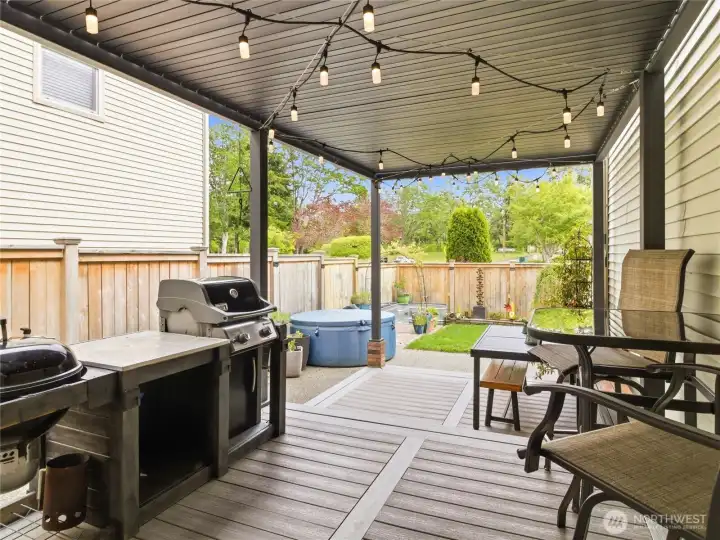 Covered patio perfection with composite decking, built-in lighting, and a cozy setup ready for summer evenings or year-round entertaining. Covered patio perfection with composite decking, built-in lighting, and a cozy setup ready for summer evenings or year-round entertaining.