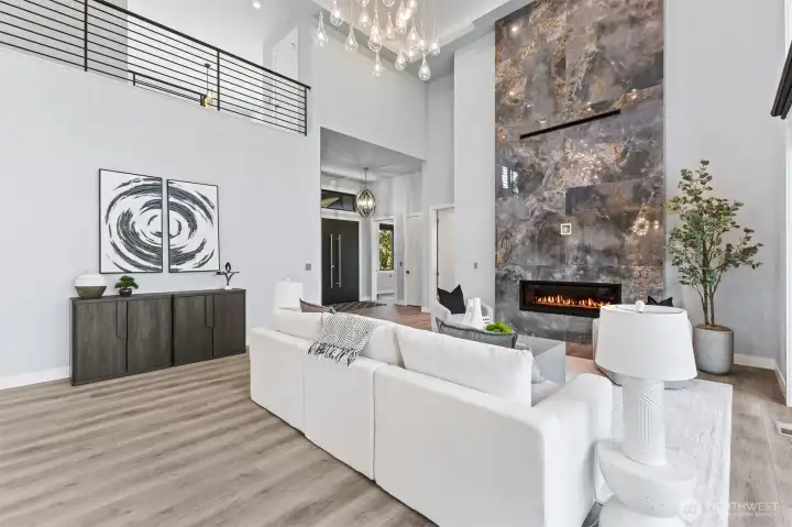 Floor to ceiling 20-foot high porcelain (4-foot by 4-foot) tiled fireplace, with Cool Smart  TV technology.