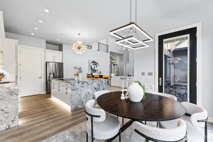 Architectural details shine throughout, from the floating upper-level overlook to the designer fixtures and upscale finishes.