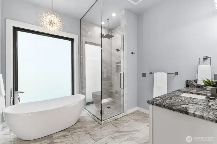 His/Her bath vanities with granite surface tops.