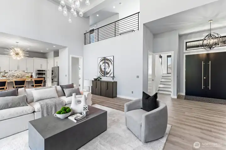Light-filled living spaces feature dramatic volume ceilings, designer finishes, and effortless flow between the kitchen, dining, and great room.