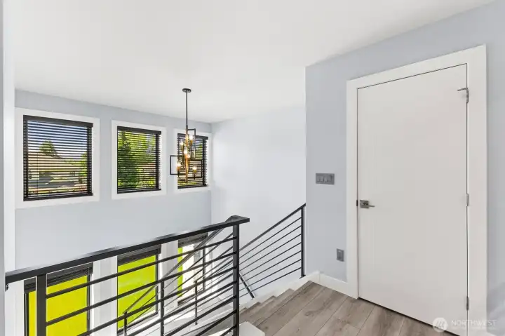Spacious open hall overlooking both front windows and to the opposite side the great room and rear landscaped property.
