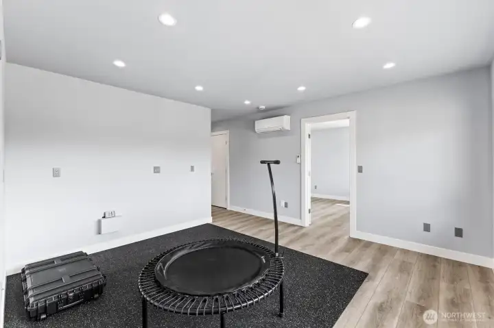 Common Room: Option to convert to secondary Kitchen. Roughed in for fridge (water  connection), vented stovetop, microwave, kitchen sink, counter top level for electrical outlets,  secondary heat pump.