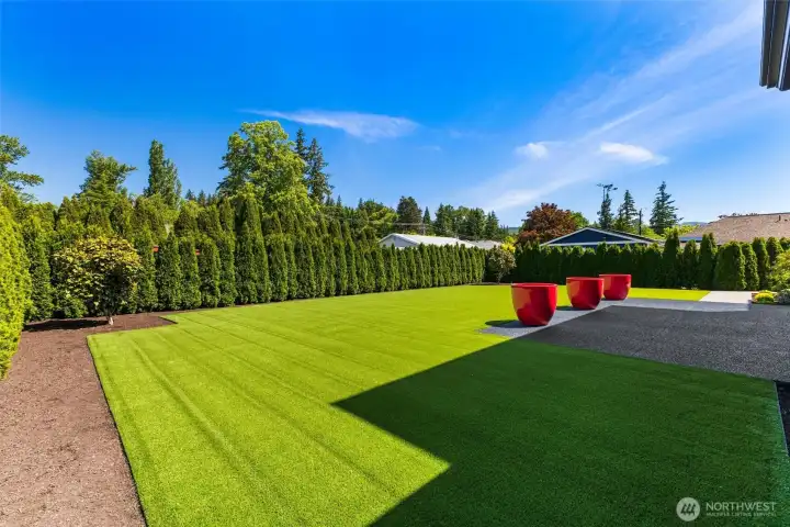Fully fenced and professionally landscaped with modern plantings including 200 Arborvitae hedges.