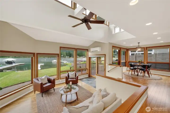 Warm wood floors and wood clad windows brings depth and character to this lovely home