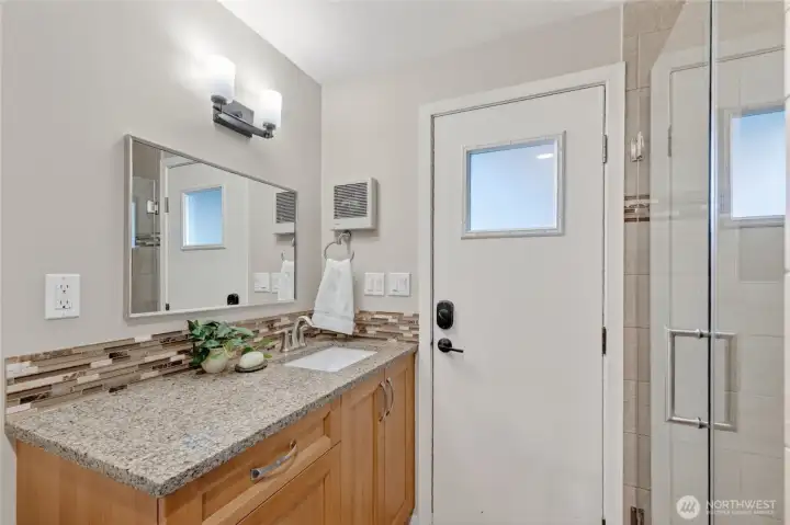 Main floor bathroom with convenient door to the courtyard is great if coming from a day on the lake