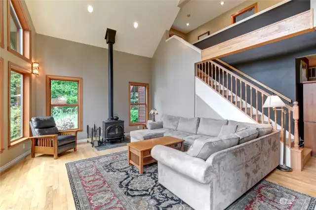 Another view of living room with the staircase behind up to two additional bedrooms and full bathroom.