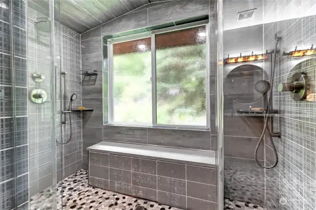 Custom built dual steam shower with bench and natural light. Feels like you are in a luxury hotel bathroom.