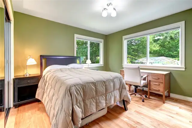 Upstairs second bedroom with two large windows. plenty of room for desk and dressers.