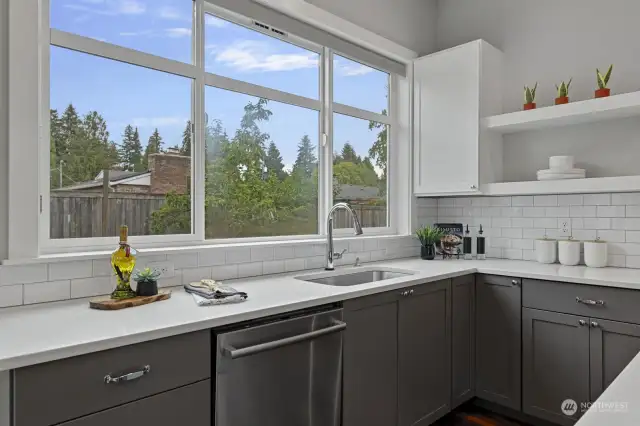 Doing the dishes won't feel like a chore here, with windows overlooking peaceful green views of the backyard.