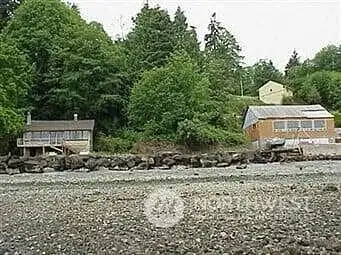 Vacant lot between both houses