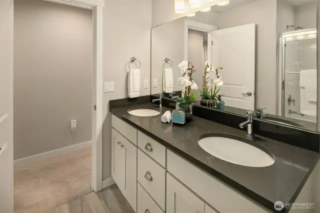 Bathroom 2 has double sinks, elevated counters, upgraded quartz countertops and comfort height toilet.