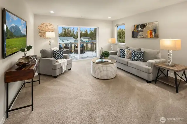 Oversize upstairs bonus room with deck access - so many possibilities for this space!