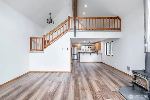 Great room looking back to kitchen and second floor