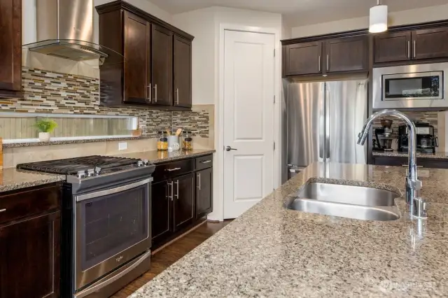 Expansive granite center island. All granite countertops. Stainless Steel Appliances.