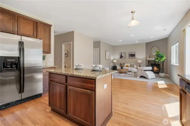 The kitchen is open to the family room and a sunny eating area.