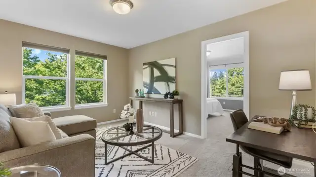 Upstairs, a spacious loft offers the perfect retreat for work or play