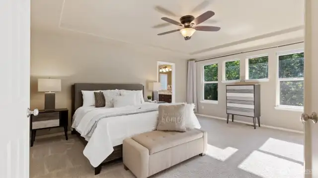An extra-large primary bedroom feels like a private retreat—airy and expansive