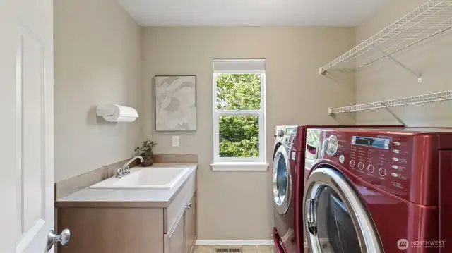 Spacious laundry room with brand new LG washer and dryer - both stay with the home