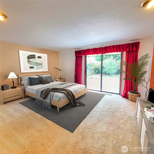 Primary bedroom w/sliding glass door to patio. Virtual staged.