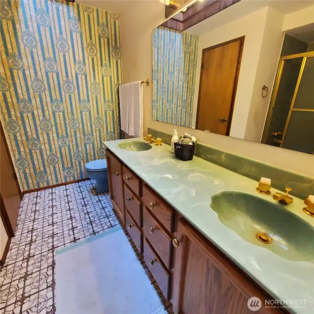 Hall full size bath w/ double sinks.