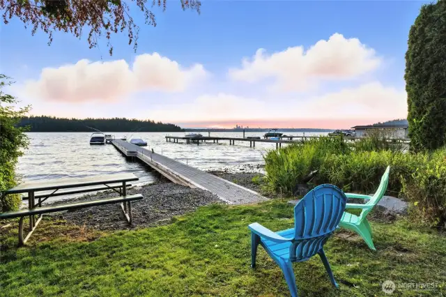 Rarely available: shared west-facing waterfront with only six owners—complete with a deeded boat slip, space to store your water toys, and a grassy area perfect for lakeside picnics. Lake life at its best!