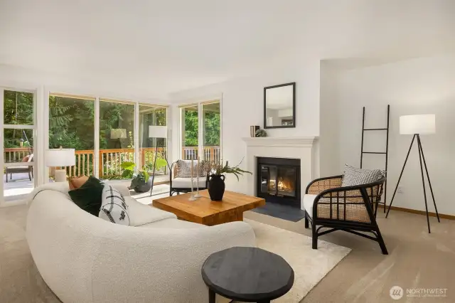 From the front entry, step into the light-filled living room with south- and west- facing windows, along with a wood-burning fireplace—perfect for cozy nights and sun-drenched days.