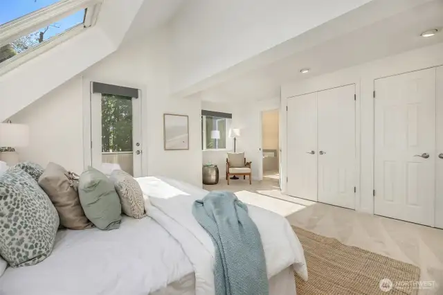 Freshly painted primary bedroom with double closets for ample storage. All west-facing windows feature remote-controlled blackout blinds for comfort and privacy.