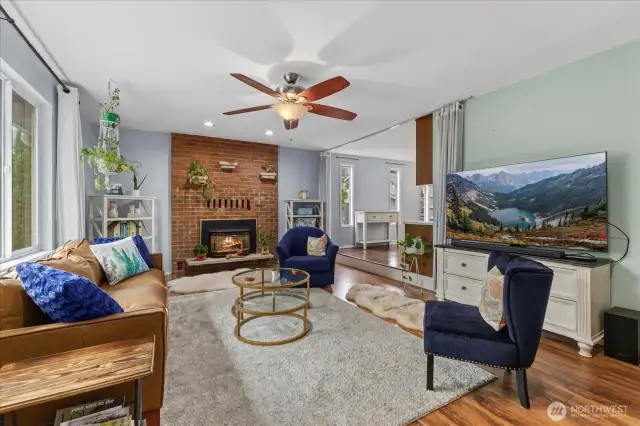 Front living area with gas fireplace and abundance light.
